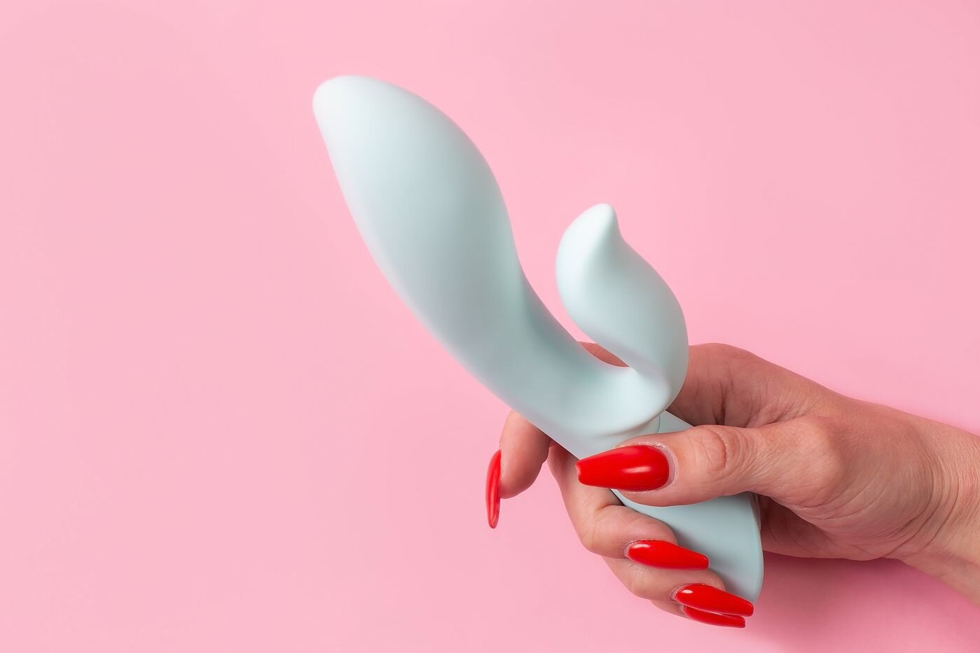 Vibrator/Toy vor rosa Hintergrund
